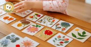 A child is playing with a set of flower cards on a table.