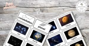 A set of planets and stars on a wooden table.