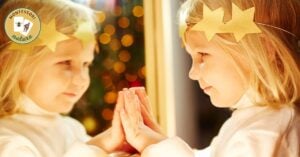 child looking into a mirror
