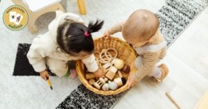 children playing with a basket full with wooden toys