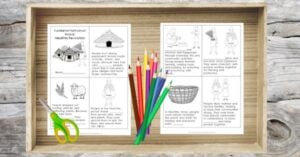 A tray holds two illustrated Neolithic Agricultural Revolution worksheets—free printables—plus colored pencils and green scissors, all arranged on a wooden surface.