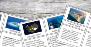 Photo of educational cards on a wooden surface, each featuring images and descriptions of different types of islands. These printables are perfect for hands-on science activities exploring coral, volcanic, tectonic, and tidal islands. Montessori Nature Printables