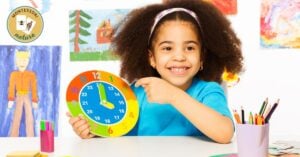 A young girl engaging in a hands-on Montessori activity, learning to tell time, as she holds a clock in front of a colorful background.